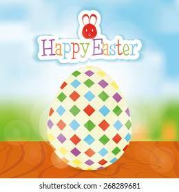 Isolated easter egg with texture and text on a landscape. Vector illustration