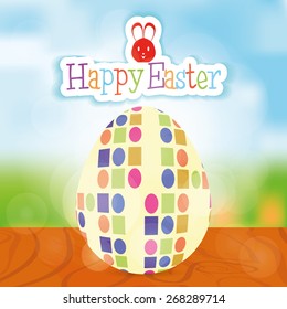 Isolated Easter egg with texture and text on a landscape. Vector illustration