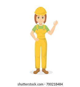 Isolated female builder with ok gesture on white background.