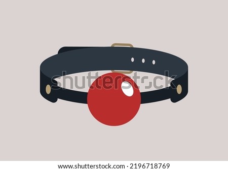 An isolated gag ball on a leather belt, adult toys