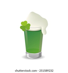 an isolated green glass of beer with foam and a clover for Patrick's day