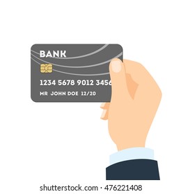 Isolated hand with credit card. Concept of credit card payment, transaction and purchase. Plastic card with chip and identification number.