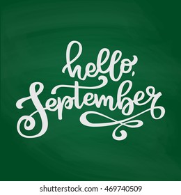 Isolated hand drawn lettering Hello September. White chalk on green chalkboard  background. Vector calligraphy for seasonal advertising.