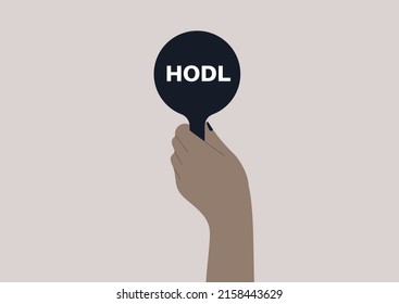 An isolated hand holding a bid with a HODL sign on it, online auction, new technologies and money investment