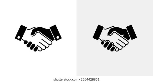 Isolated handshake vector graphics showcase a business agreement. The image depicts two black icons of clasped hands against a divided white and light gray background, emphasizing cooperation.