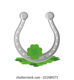 an isolated horseshoe and clovers for Patrick's day