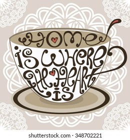 Isolated icon of cup made from words. Cup with inscription Home is where the heart is.Hand drawn interior poster.Calligraphic cute postcard.Typography lettering for t-shirt or for your cafe business.