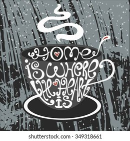 Isolated icon of cup made from words.Inscription Home is where the heart is.Hand drawn interior poster.Calligraphic cute postcard.Typography lettering for t-shirt or for cafe business.Christmas design