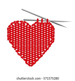 Isolated knit red heart with two needles on white background. 