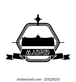 an isolated label with a black silhouette of the royal palace of madrid