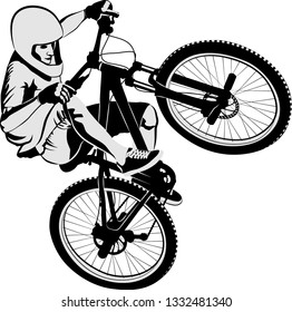 isolated man doing bike trick
