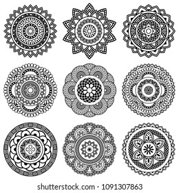 Isolated mandala in vector. Collection of round patterns in white and black colors. Vintage decorative elements. Set of abstract weaves for cards and coloring books