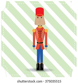 Isolated nutcracker soldier on a green textured background