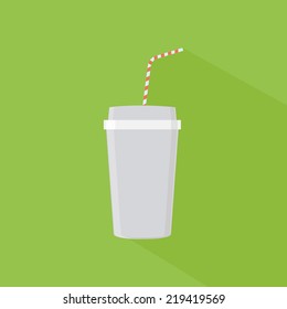 an isolated plastic cup with a milk shake on a green background