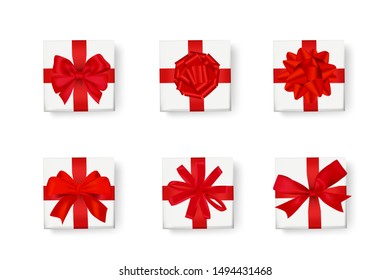 isolated of realistic red ribbon bow on mockup white gift boxes set on white background. Concept for ribbon tie for new year or christmas decoration in vector illustration