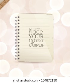 Isolated recycled paper notebook on bright background.