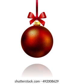 Isolated red Christmas ball hanging on a ribbon