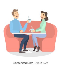 Isolated romantic couple sitting at the cafe and drink coffee.