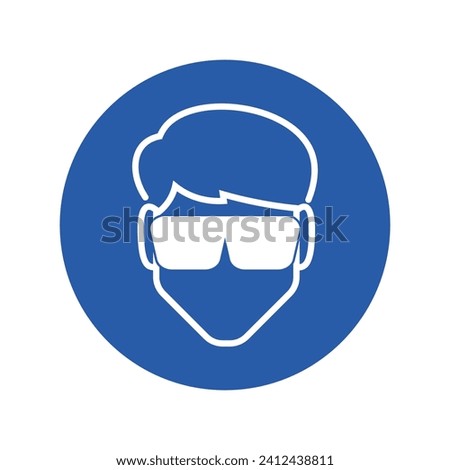 Isolated round blue instruction sign of mandatory to wear a safety glasses or goggle, eye protection sign