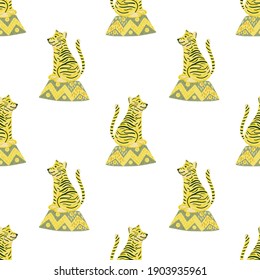 Isolated seamless pattern with yellow cartoon tiger silhouettes. White background. Circus print. Vector illustration for seasonal textile prints, fabric, banners, backdrops and wallpapers.