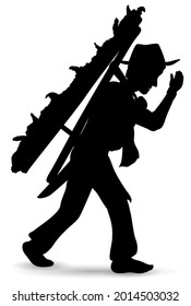 Isolated silhouette of a Silletero man holding on its back a floral arrangement during the celebration of Festival of the Flowers parade.