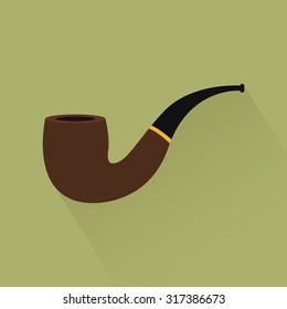 Isolated smoking pipe on a green background
