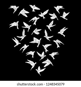 Isolated textured stipple silhouette of white birds flock in the black air Inspirational body flash tattoo ink. Vector.