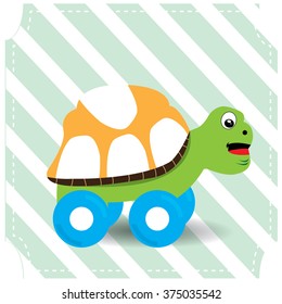 Isolated turtle toy on a blue textured background