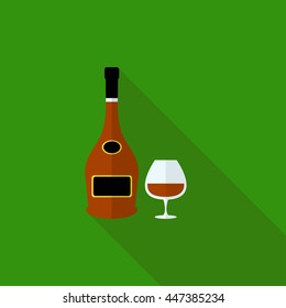 Isolated vector bottle of brandy and glass for brandy on green background, wine, flat.