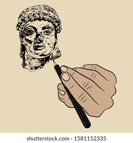 Isolated vector illustration. Human hand drawing the head of ancient Greek goddess. Metaphor for humankind making its own history. Man creates his god. Art studio logo.