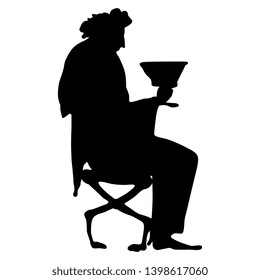 Isolated vector illustration. Silhouette of a seated ancient Greek god Dionysus holding a cup of wine. Vase painting motif. Ethnic style. Black silhouette on white background.