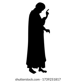 Isolated vector illustration. Silhouette of standing Christian saint with pointing gesture. 