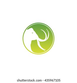 Isolated white mammoth head side view silhouette vector logo. Round shape african animal image on a green coin logotype.