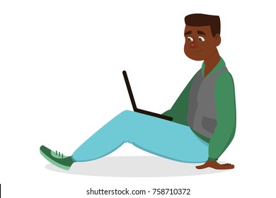 Isolated young african man sitting with laptop on white.