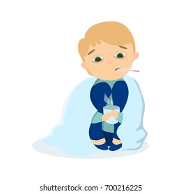 Isolted sick boy sitting with coat and hot drink in mug with thermometer on white background.