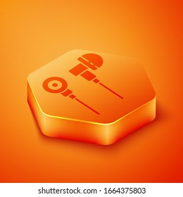 Isometric Air headphones icon icon isolated on orange background. Holder wireless in case earphones garniture electronic gadget. Orange hexagon button. Vector Illustration