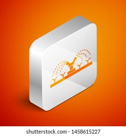 Isometric Automatic irrigation sprinklers icon isolated on orange background. Watering equipment. Garden element. Spray gun icon. Silver square button. Vector Illustration
