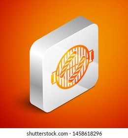 Isometric Barbecue grill with sausage icon isolated on orange background. BBQ grill party. Silver square button. Vector Illustration