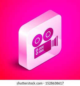Isometric Cinema camera icon isolated on pink background. Video camera. Movie sign. Film projector. Silver square button. Vector Illustration