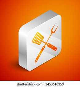 Isometric Crossed fork and spatula icon isolated on orange background. BBQ fork and spatula sign. Barbecue and grill tools. Silver square button. Vector Illustration