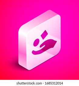 Isometric Cube levitating above hand icon isolated on pink background. Levitation symbol. Silver square button. Vector Illustration