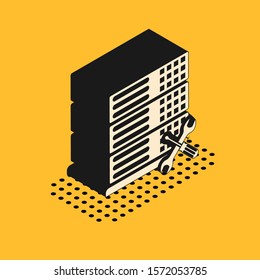 Isometric Database server with screwdriver and wrench icon isolated on yellow background. Adjusting, service, setting, maintenance, repair, fixing.  Vector Illustration