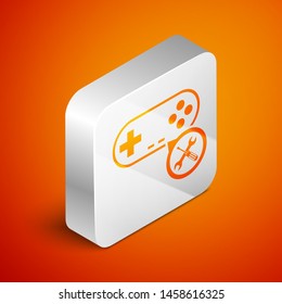 Isometric Gamepad with screwdriver and wrench icon isolated on orange background. Adjusting, service, setting, maintenance, repair, fixing. Silver square button. Vector Illustration