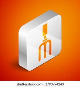 Isometric Garden rake icon isolated on orange background. Tool for horticulture, agriculture, farming. Ground cultivator. Silver square button. Vector