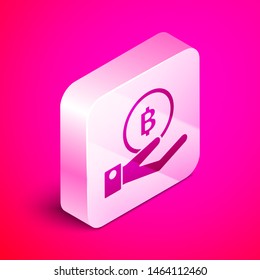 Isometric Hand holding Bitcoin icon isolated on pink background. Blockchain technology, digital money market, cryptocoin wallet. Silver square button. Vector Illustration