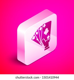 Isometric Hand holding playing cards icon isolated on pink background. Casino game design. Silver square button. Vector Illustration