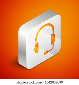 Isometric Headphones with microphone icon on orange background. Earphones sign. Concept object for listening to music, service, communication and operator. Silver square button. Vector Illustration