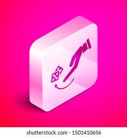 Isometric Human hand throwing game dice icon isolated on pink background. Silver square button. Vector Illustration