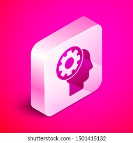 Isometric Human head with gear inside icon isolated on pink background. Artificial intelligence. Thinking brain sign. Symbol work of brain. Silver square button. Vector Illustration