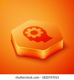 Isometric Human head with gear inside icon isolated on orange background. Artificial intelligence. Thinking brain. Symbol work of brain. Orange hexagon button. Vector Illustration